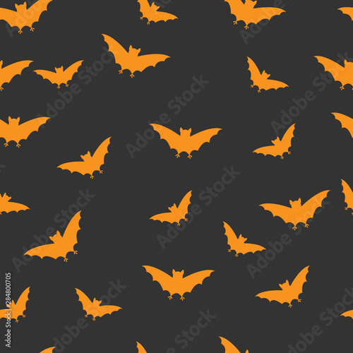 Vector seamless halloween pattern with hand draw silhouette of orange bats on dark grey background