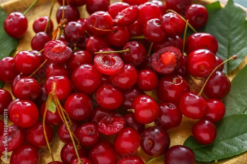 Many ripe sweet cherry on tray, closeup