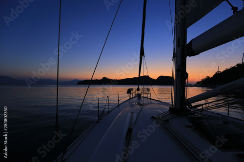 Sailing yacht moored after sunset