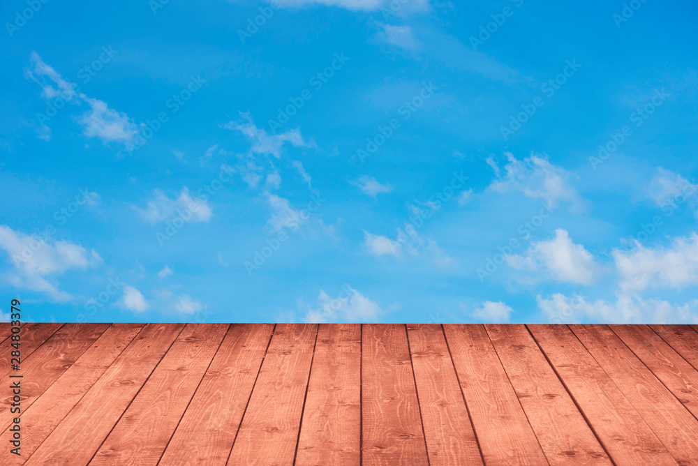 wood perspective with blue sky in background for advertise