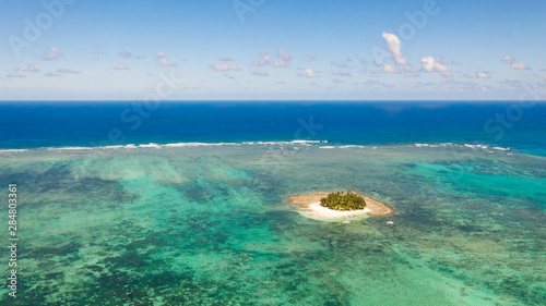 Guyam island, Siargao, Philippines. Small island with palm trees and a white sandy beach. Philippine Islands. photo