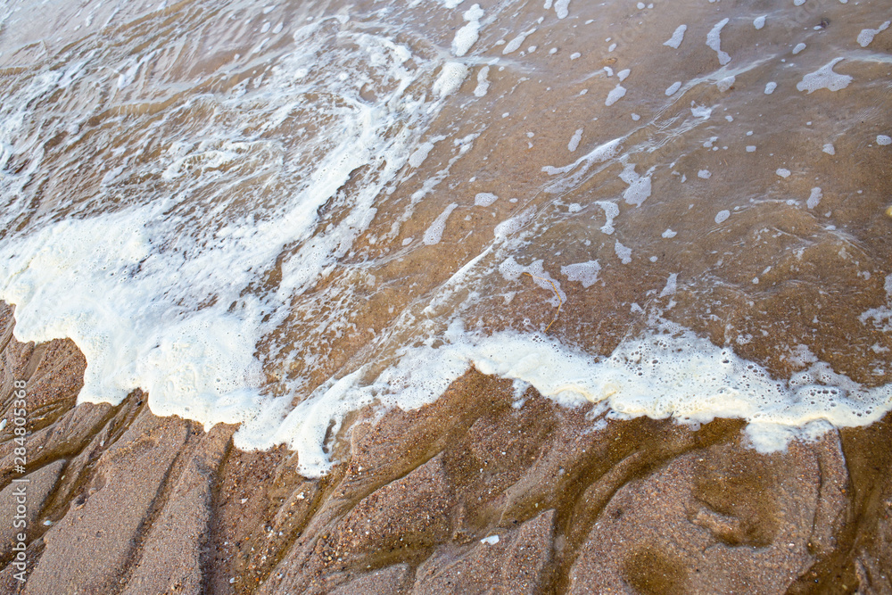 Fototapeta premium Dirty Sea foam or Whipping cream ocean, Pollution of environment