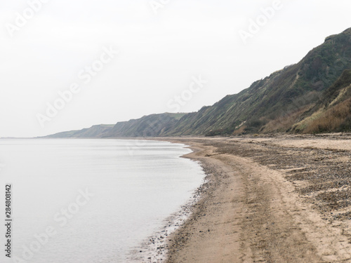 landscape with steep North Sea coast  cloudy day  gray sky