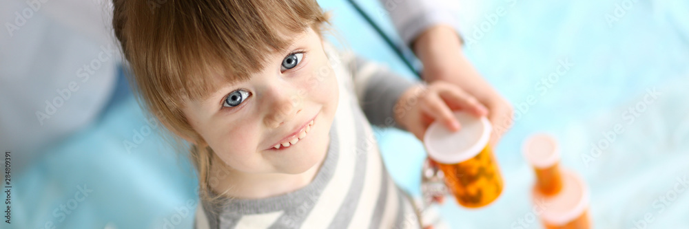 Cute little girl at doctor reception getting medications prescription portrait Cute little girl at doctor reception getting medications prescription portrait