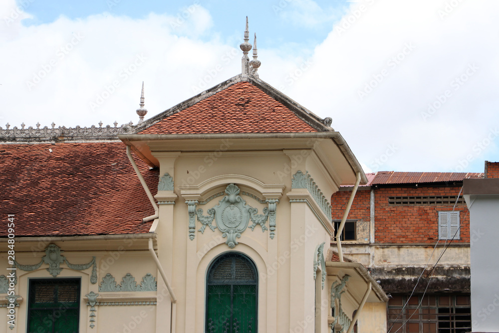 Old local vintage building of the heritage colonial architecture in Phnom Penh, Cambodia.