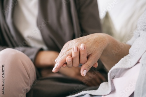 Fotografie Caregiver holding the hand