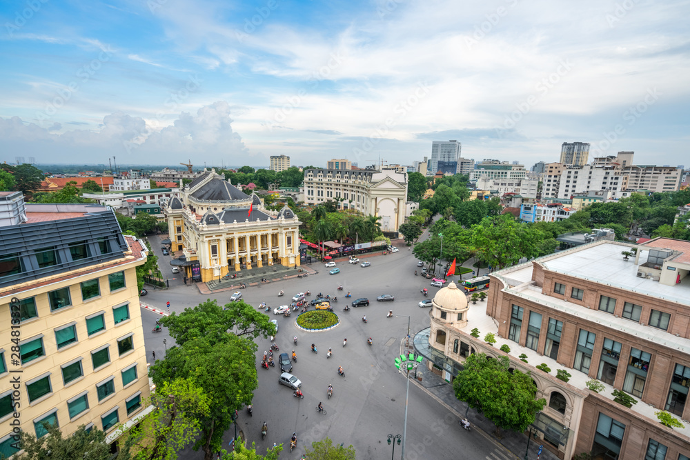 Fototapeta premium Aerial skyline view of Hanoi city, Vietnam. Hanoi cityscape by sunset period at August Revolution Square, with Hanoi Opera House