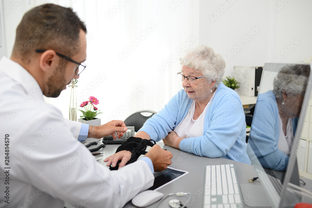 elderly senior woman having a medical consultation with her doctor in office diagnostic elderly senior woman having a medical consultation with her doctor in office diagnostic