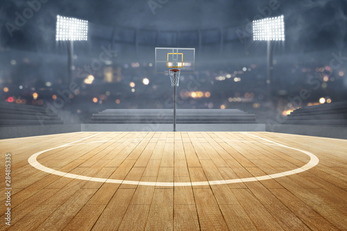 Basketball court with wooden floor, lights reflectors, and tribune © Leo Lintang