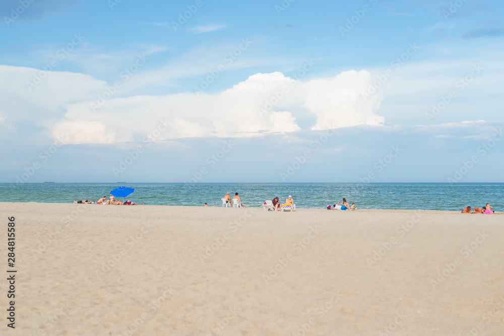 Gribovka, Odessa region, - June 09, 2109: Coast of the sea coast with resting people.