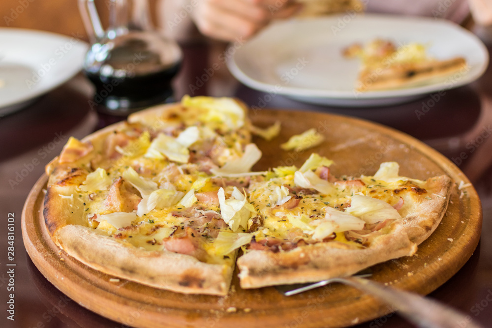 Freshly made pizza on the table. Preparing to eat. Freshly made pizza on the table. Preparing to eat.