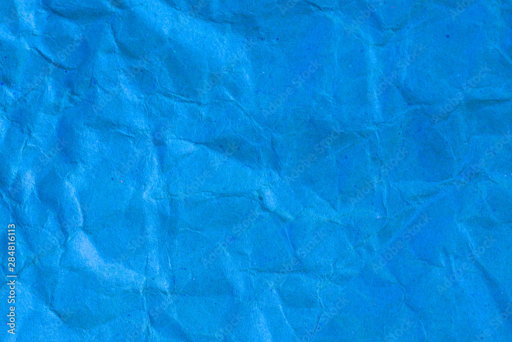 Texture crumpled blue paper background.