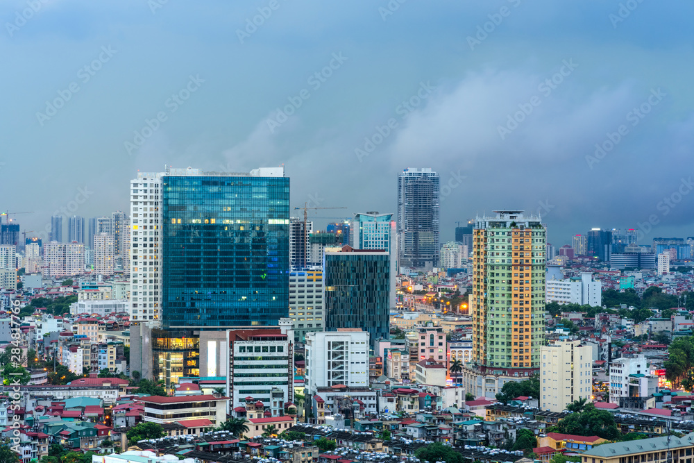 Obraz premium Aerial skyline view of Hanoi city, Vietnam. Hanoi cityscape by sunset period at Ba Dinh district viewing from Lang Ha street