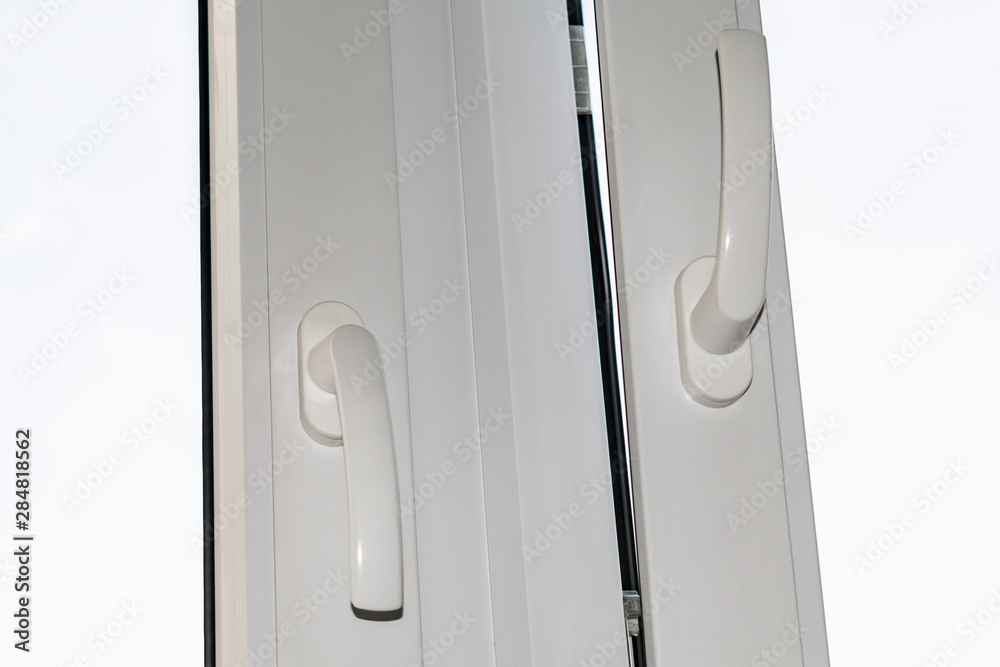 A fragment of the sash with handle glazed balconies, plastic Windows
