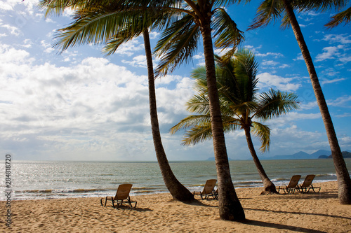 Deck chairs on a tropical beach in Far North Queensland  Australia.