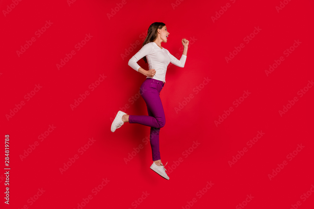 Full length body size photo of joyful encouraged nice cute girlfriend running towards shopping mall because there are discounts while isolated with red background Full length body size photo of joyful encouraged nice cute girlfriend running towards shopping mall because there are discounts while isolated with red background