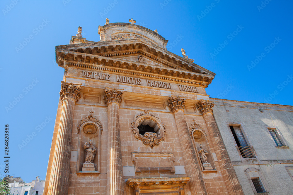 Obraz premium Confraternity of Carmine church in Ostuni known as white city, famous tourist destination in Brindisi province, Region Apulia(Puglia), southern Italy.