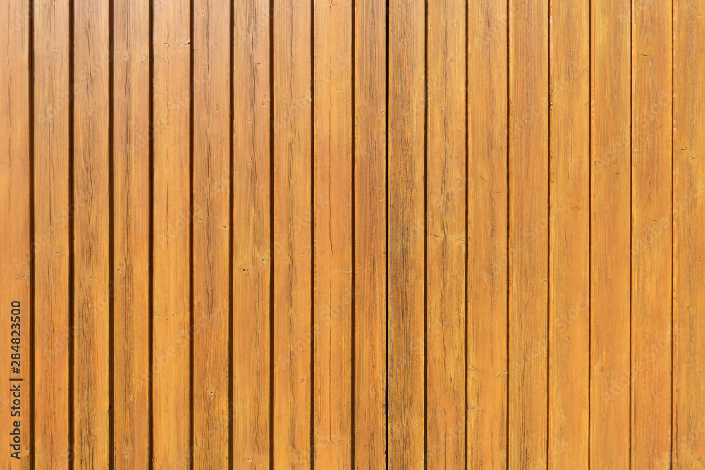 Honigfarbene vertikale Holzwand Honigfarbene vertikale Holzwand