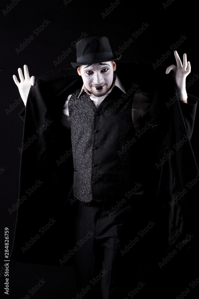 mime shows theatrical emotions on black background mime shows theatrical emotions on black background