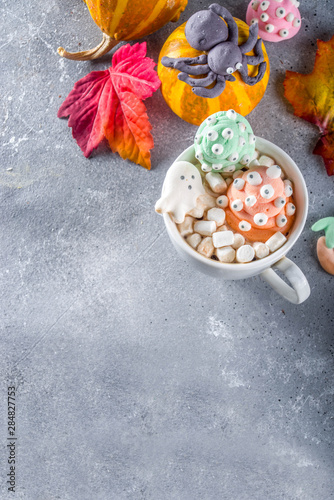 Halloween hot chocolate mugs with funny marshmallows - jack o lantern pumpkins, ghost, monsters, spiders.