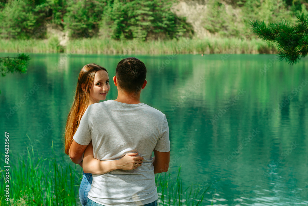 Loving couple holding tight and embracing close Loving couple holding tight and embracing close