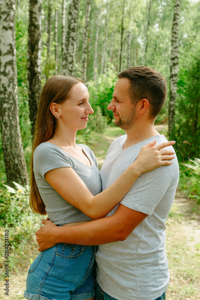 Loving couple holds hands and hugs each other. Loving couple holds hands and hugs each other.