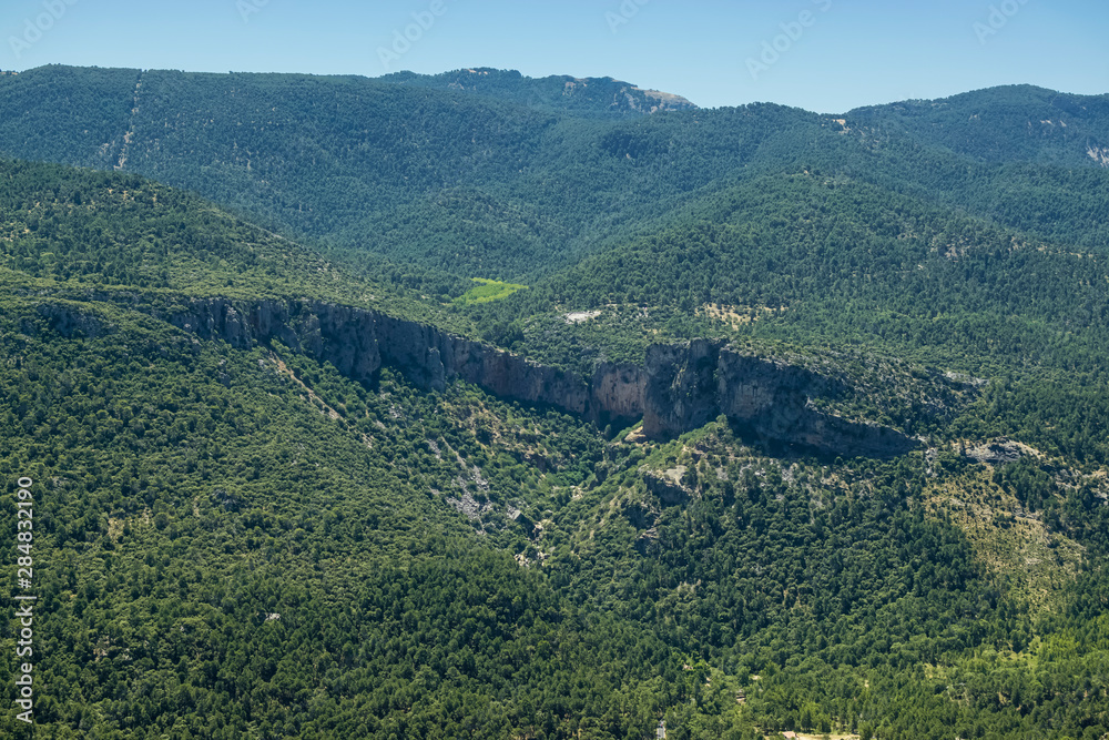 View from a viewpoint of the Mountain Range of Cazorla with detail of a ridge in the middle of several mountains. Photography taken in the Mountain Range of Cazorla Jaen, Spain