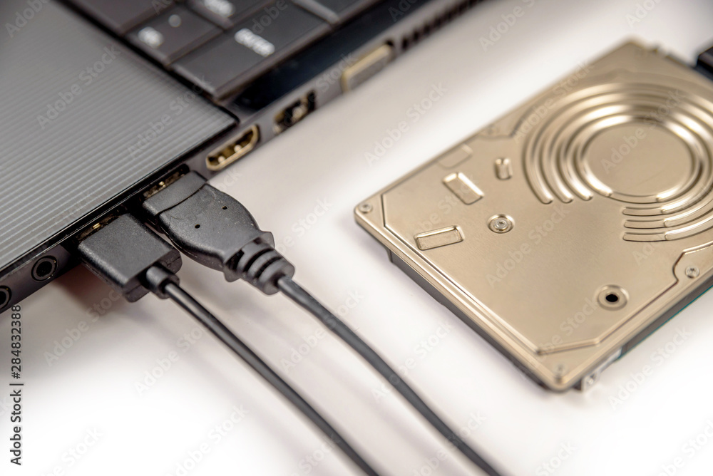 hdd 2.5 internal hard drive disk connected to laptop via sata usb cable closeup view hdd 2.5 internal hard drive disk connected to laptop via sata usb cable closeup view
