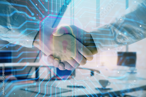 Wallpaper Mural Double exposure of lock icon hologram on office background with two men handshake. Concept of data safety Torontodigital.ca