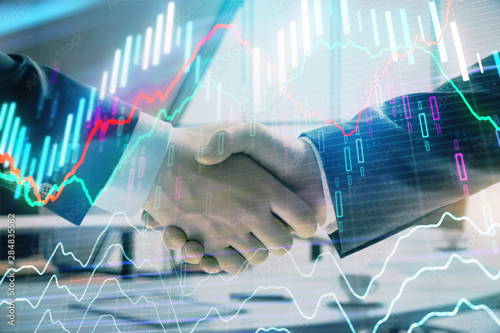 Multi exposure of financial graph on office background with two businessmen handshake. Concept of success in business Multi exposure of financial graph on office background with two businessmen handshake. Concept of success in business