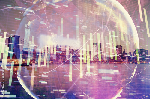 Double exposure of business theme hologram drawing and city veiw background. Concept of success.