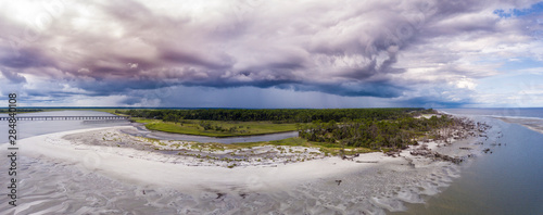 180 degree aerial panorama of dramatic storm front moving over Hunting Island  South Carolina.