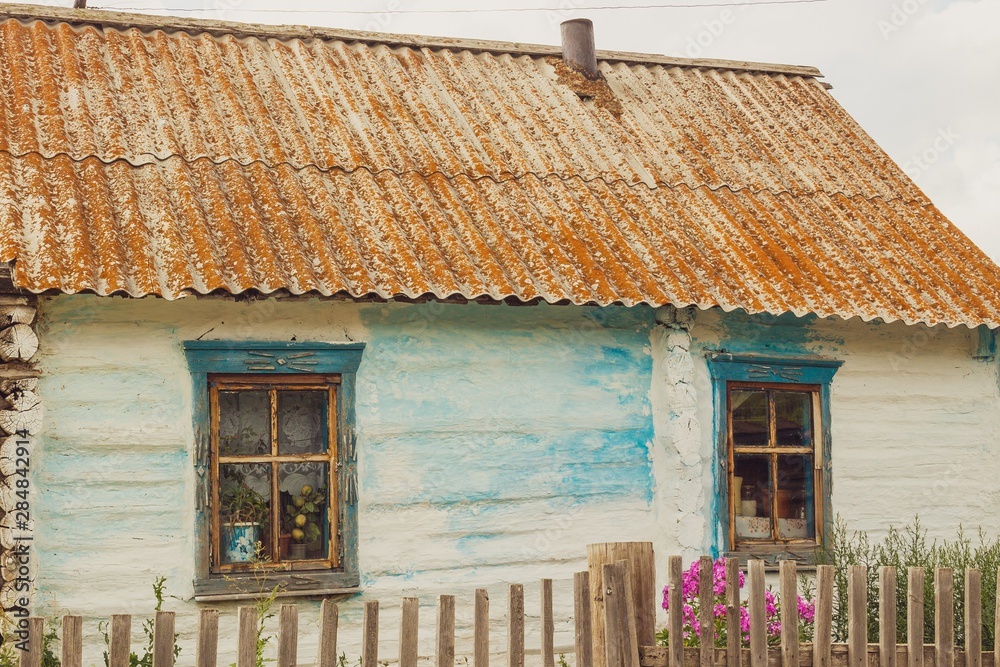 Russian village in summer,old traditional wooden house. Altay region, Russia.