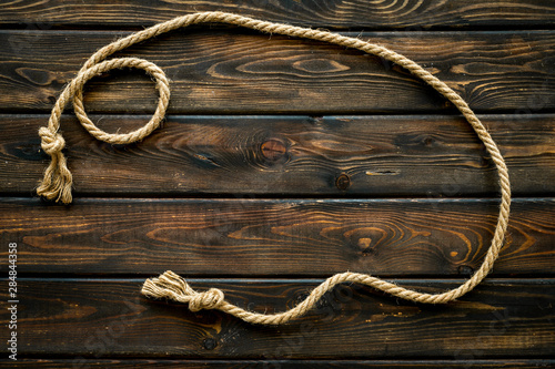 rope frame on wooden background top view mock-up