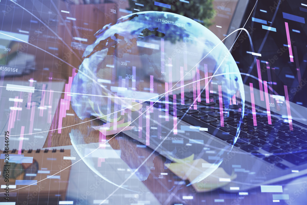 Double exposure of graph and financial info and work space with computer background. Concept of international online trading. Double exposure of graph and financial info and work space with computer background. Concept of international online trading.