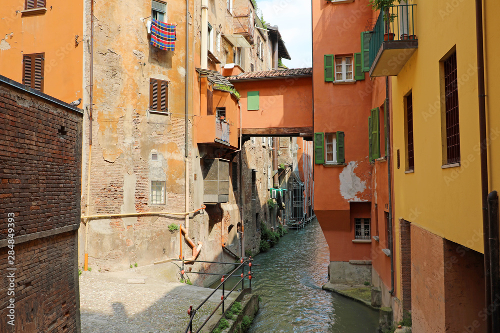 Italian houses between the hidden canal of Reno river, Bologna, Italy.  Stock Photo | Adobe Stock