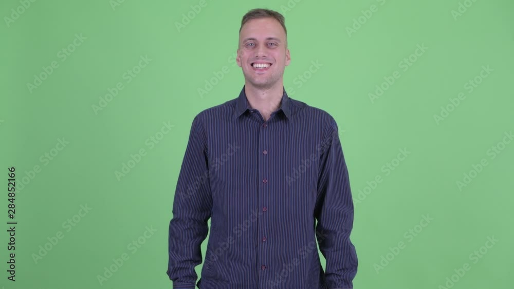 Portrait of happy handsome businessman smiling