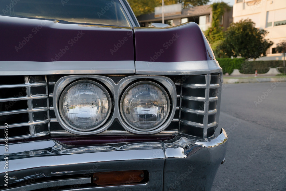 A purple classic american car at street