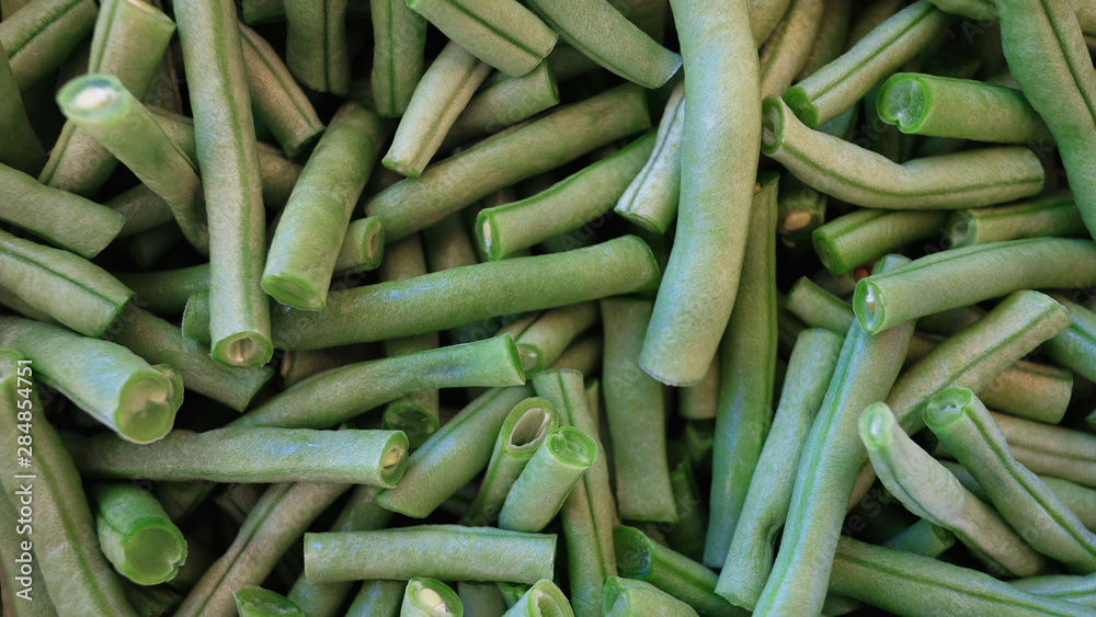 Raw french beans known also as haricot vert, cleaned and cut in short segments, ready to be used in a vegetarian or vegan dish or paired with other dishes, either blanched, fried, sauteed or steamed Raw french beans known also as haricot vert, cleaned and cut in short segments, ready to be used in a vegetarian or vegan dish or paired with other dishes, either blanched, fried, sauteed or steamed