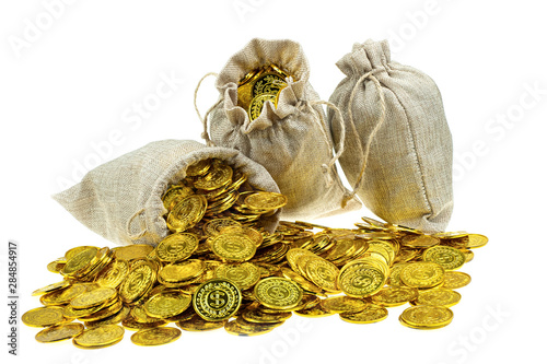 Stacking gold coin in treasure sack on white background photo