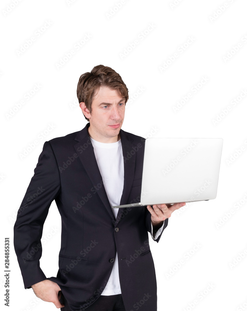 Portrait of handsome young businessman standing holding laptop computer and checking email or confused more data, isolated on white background. Portrait of handsome young businessman standing holding laptop computer and checking email or confused more data, isolated on white background.