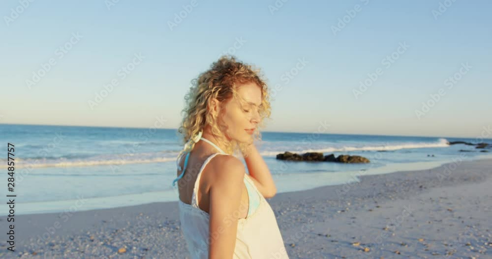 Young woman relaxing by the sea 4k Young woman relaxing by the sea 4k