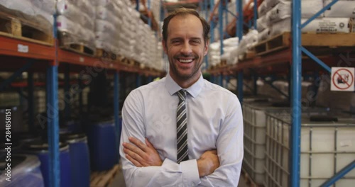 Portrait of male manager smiling in a warehouse 4k photo