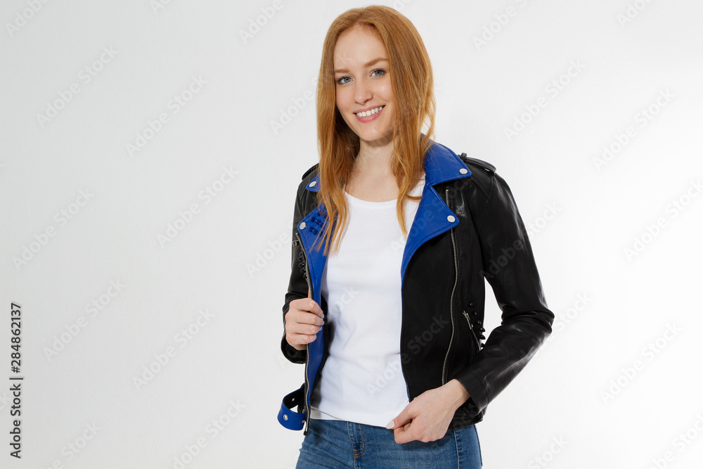 Young Woman In White Leather Jacket In A Tshirt In Black Jeans