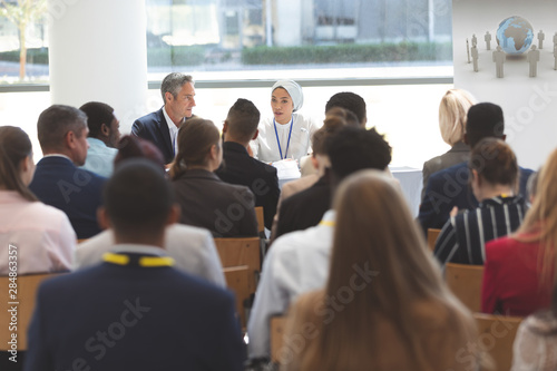 Group of business people attending a business seminar © WavebreakMediaMicro