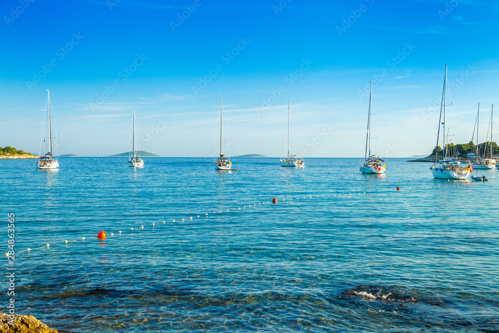 Croatia, Adriatic sea, yachting paradise, sailing boats and yachts in the morning in blue bay lagoon on Murter island