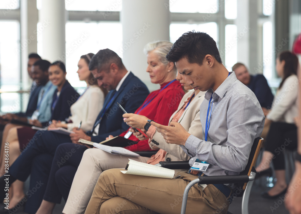 Business people attending a business seminar Business people attending a business seminar