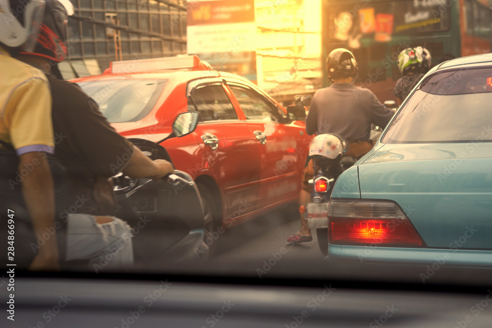 Cars and Motorcycles wait at traffic jam in the morning in polution concept