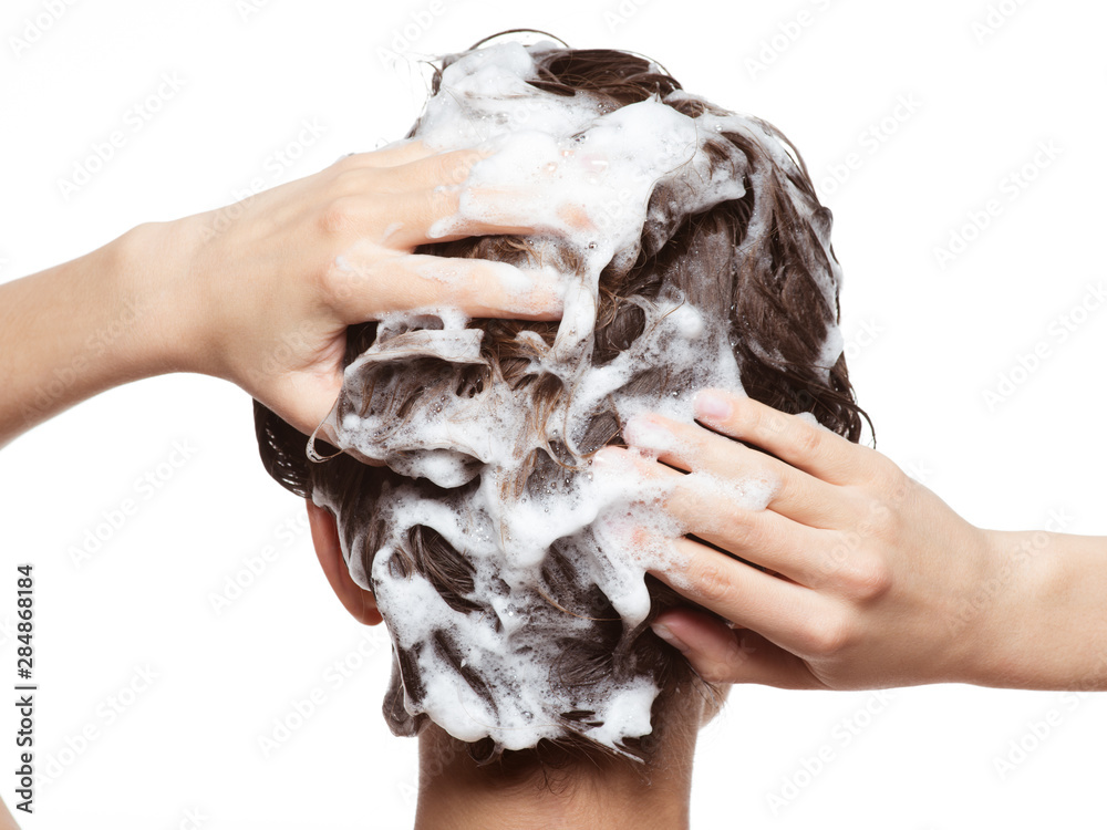 Woman soaping the hair. Beauty treatment - obrazy, fototapety, plakaty 