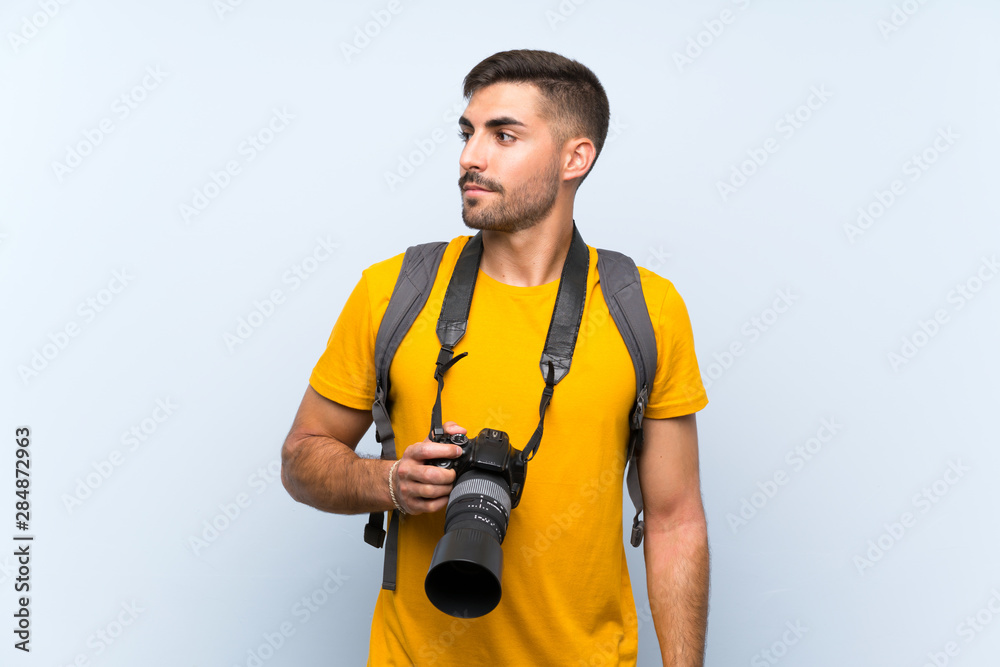 Young photographer man looking side